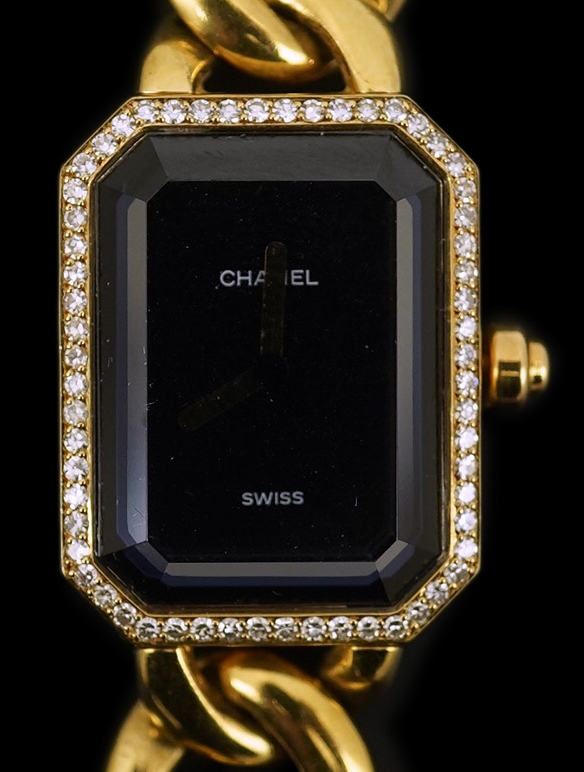 A lady's modern 18ct gold and diamond set Chanel quartz wrist watch, on an 18ct gold Chanel oval link bracelet